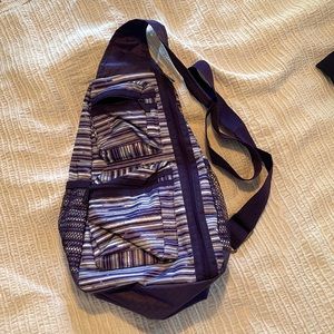 Purple striped Thirty-One sling backpack
